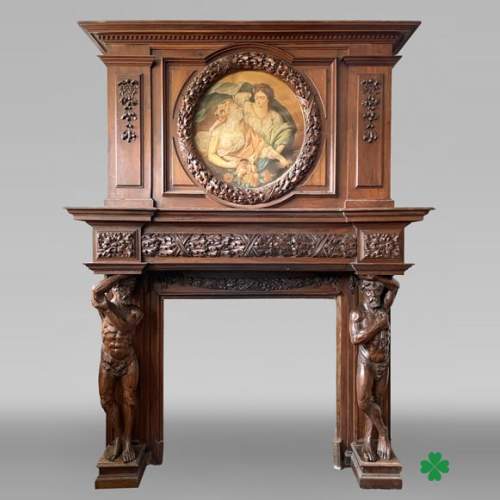 Monumental carved walnut fireplace with atlantes and painted medallion