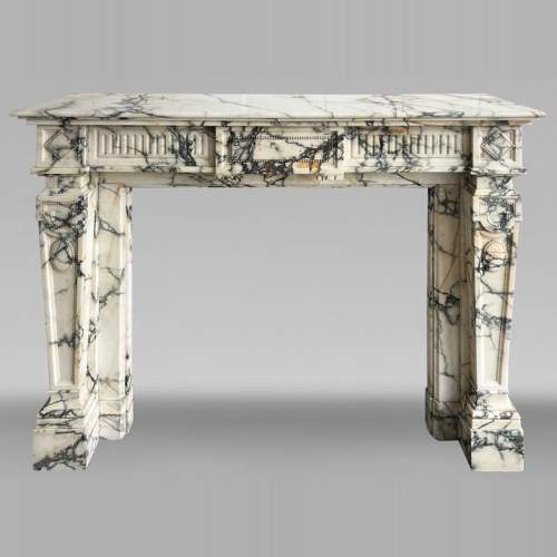 Louis XVI style fireplace in Paonazzo marble, decorated with a pearl frieze