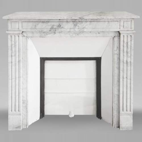 Louis XVI style fireplace in Carrara marble, with molded decoration
