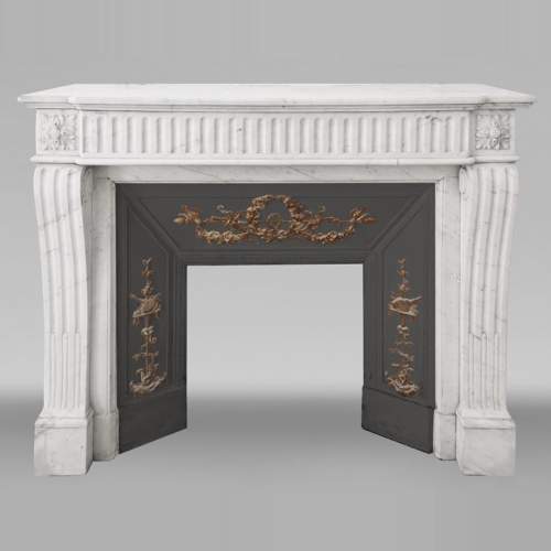 Louis XVI style fireplace in half-statuary marble, with rudenté decoration