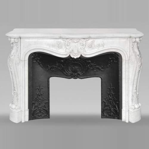 Louis XV style fireplace in Carrara marble richly carved with plant motifs