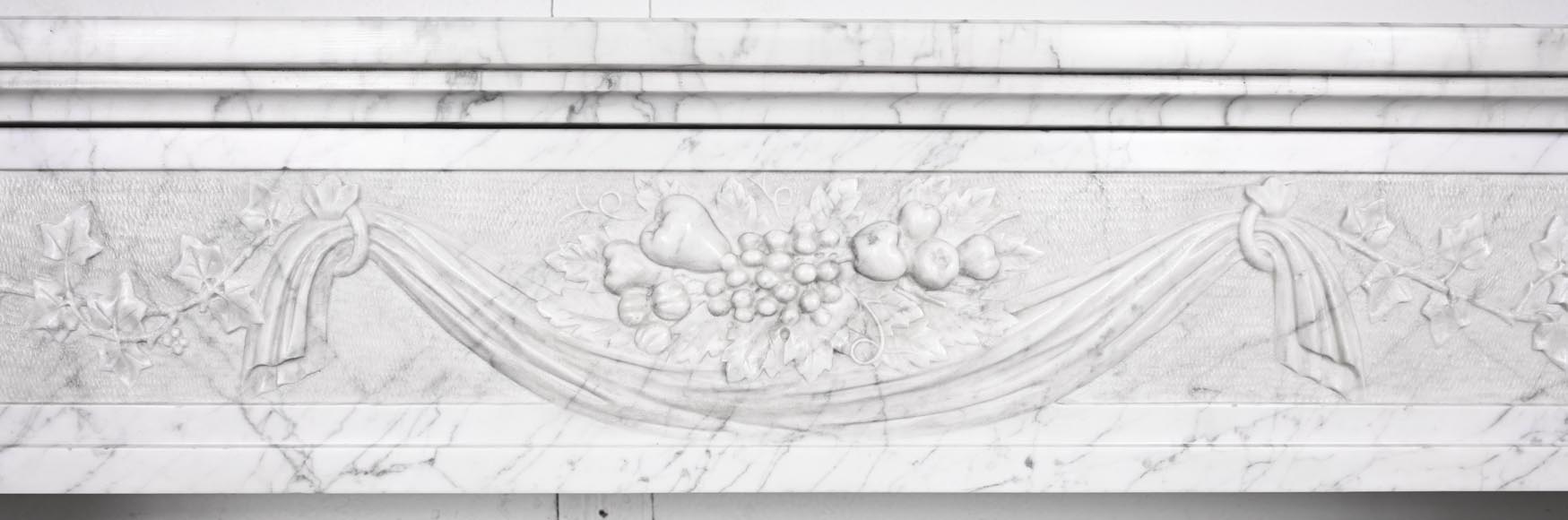 Louis XVI period fireplace with carved fruit decoration, in veined Carrara marble-1