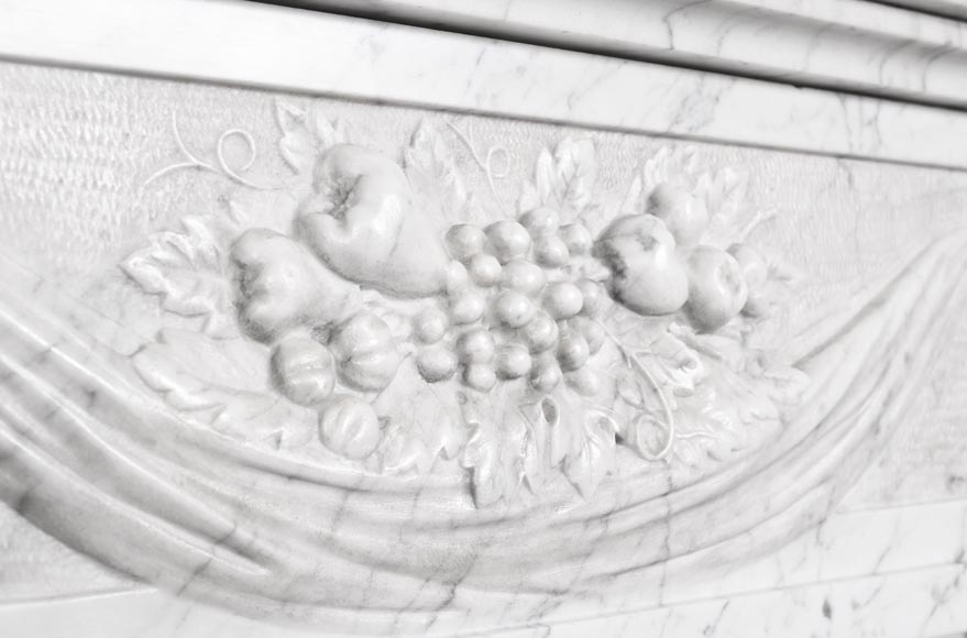 Louis XVI period fireplace with carved fruit decoration, in veined Carrara marble-2