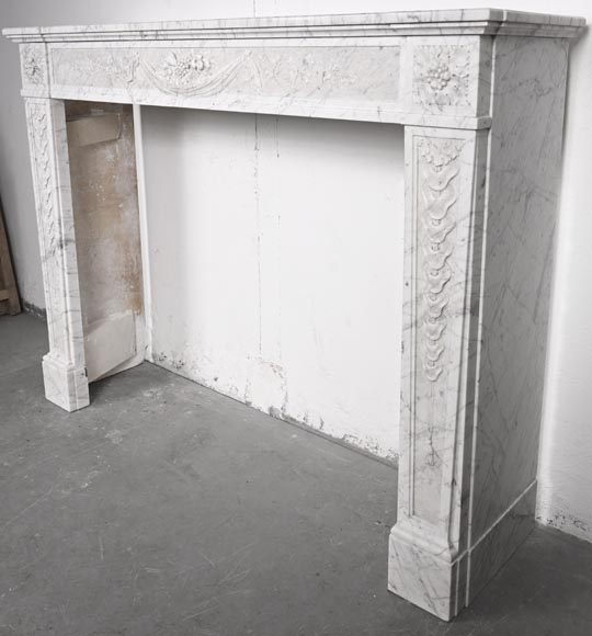 Louis XVI period fireplace with carved fruit decoration, in veined Carrara marble-10