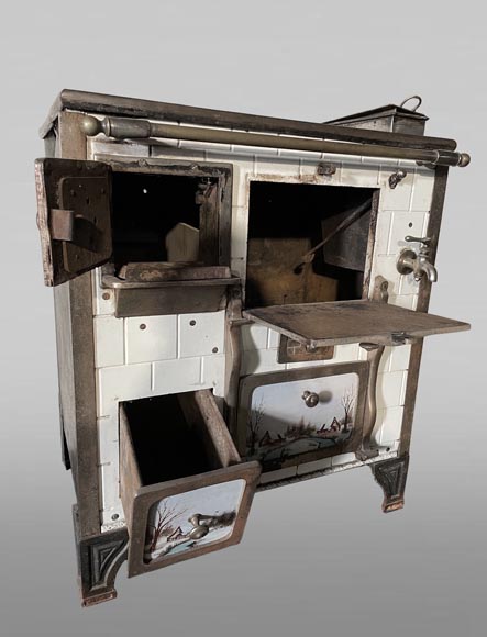 Cast-iron stove with faience imitation and snowy landscape decoration-2