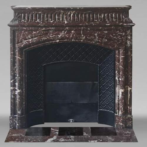 Louis XVI style fireplace with acroterion in Northern Red marble