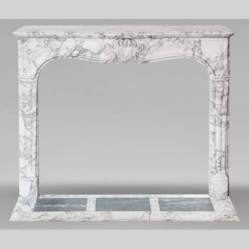 Louis XV style fireplace with palmette motif, carved in Arabescato marble