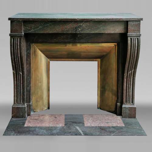 Napoleon III style fireplace in a marble similar to Campan marble, with its brass interior