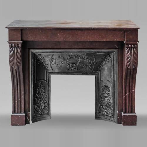 Napoleon III style fireplace decorated with acanthus leaves, in griotte red marble