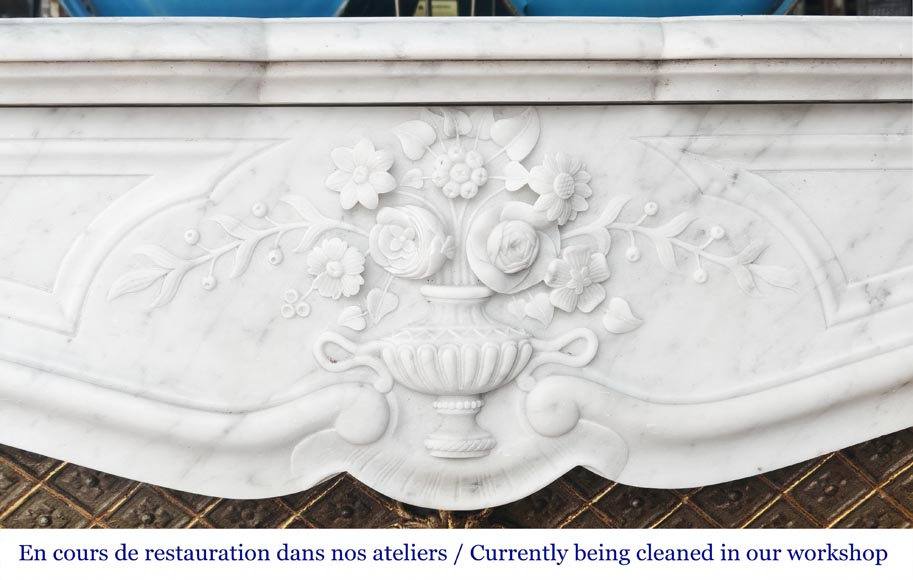 Louis XV style fireplace in Carrara marble, decorated with a vase of flowers Louis XV style fireplace in Carrara marble, decorated with a vase of flowers-1