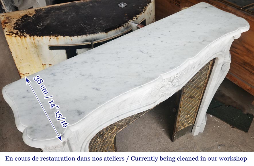 Louis XV style fireplace in Carrara marble, decorated with a vase of flowers Louis XV style fireplace in Carrara marble, decorated with a vase of flowers-13