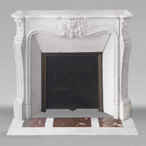 Louis XV style fireplace with shell decoration, in Carrara marble