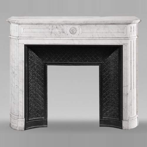Louis XVI style fireplace with rounded corners and sunflower motif, in Carrara marble