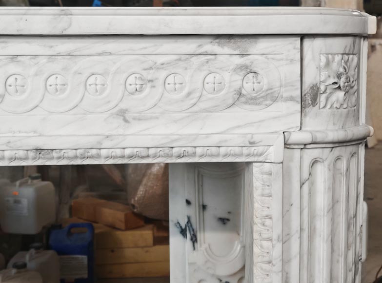 A Louis XVI period fireplace in veined Carrara marble, decorated with a Greek-style frieze. A Louis XVI period fireplace in veined Carrara marble, decorated with a Greek-style frieze.-7