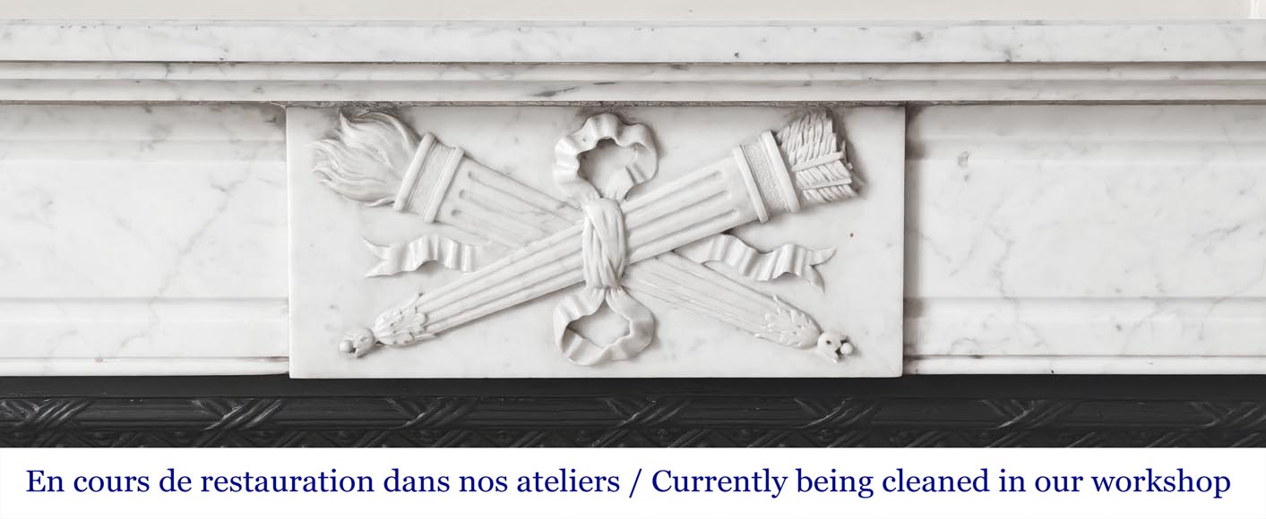 Louis XVI style fireplace in Carrara marble decorated with a torch and a quiver Louis XVI style fireplace in Carrara marble decorated with a torch and a quiver-1