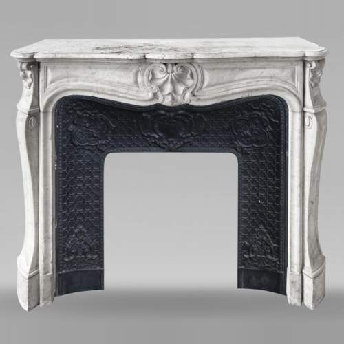 Louis XV style fireplace in Carrara marble decorated with a shell