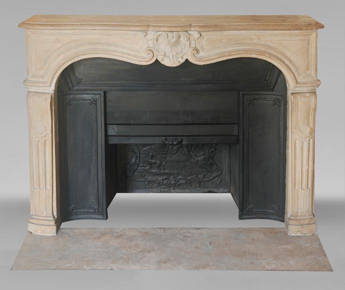 Louis XV-style stone fireplace, decorated with a shell motif. Louis XV-style stone fireplace, decorated with a shell motif.-0