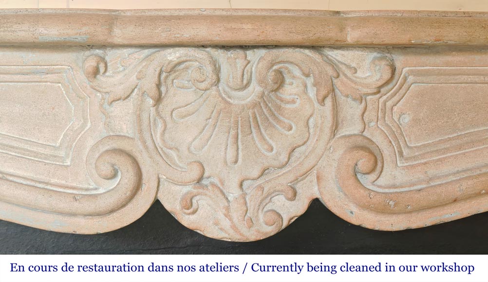 Louis XV-style stone fireplace, decorated with a shell motif. Louis XV-style stone fireplace, decorated with a shell motif.-1