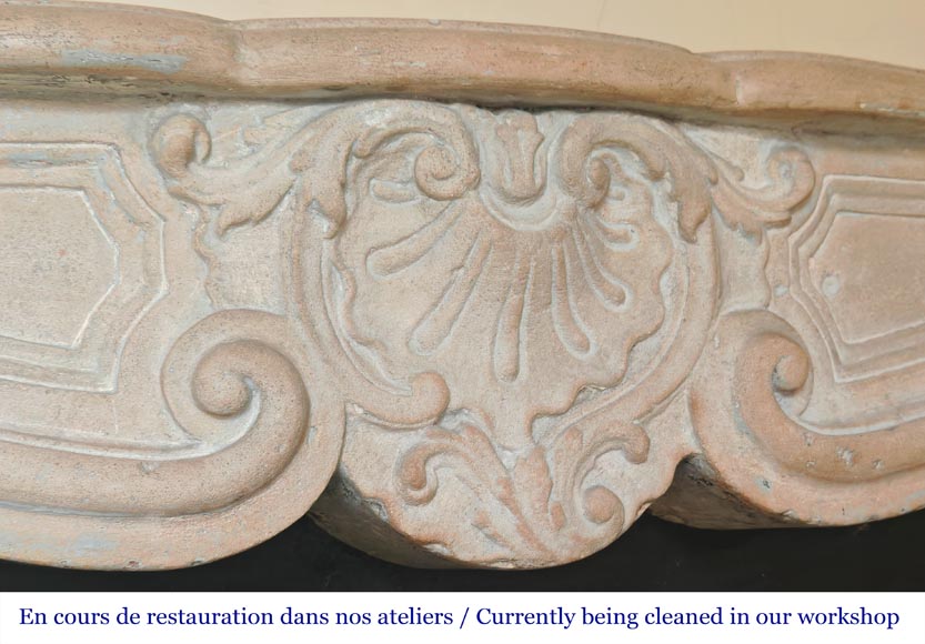Louis XV-style stone fireplace, decorated with a shell motif. Louis XV-style stone fireplace, decorated with a shell motif.-2