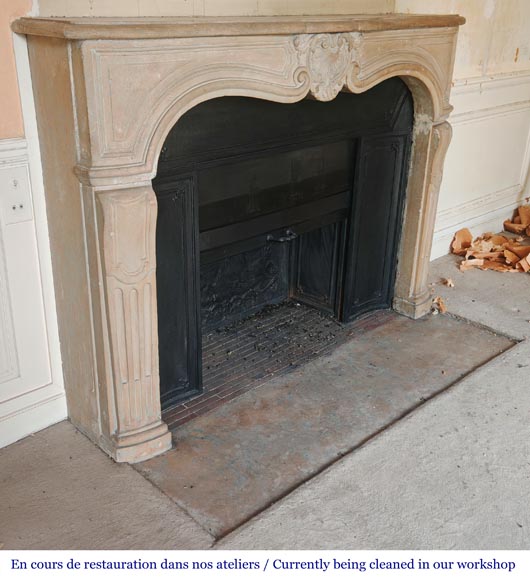 Louis XV-style stone fireplace, decorated with a shell motif. Louis XV-style stone fireplace, decorated with a shell motif.-3