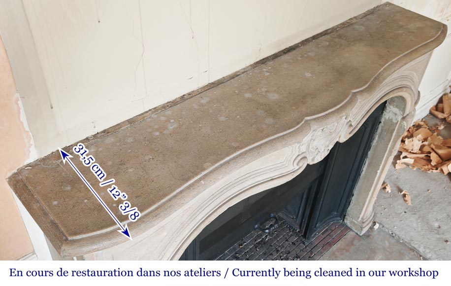 Louis XV-style stone fireplace, decorated with a shell motif. Louis XV-style stone fireplace, decorated with a shell motif.-10