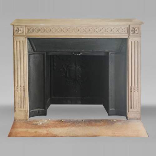 Louis XVI style fireplace decorated with a Greek key frieze