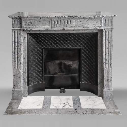  Louis XVI-style fireplace in blue fleuri marble, featuring fluted decoration