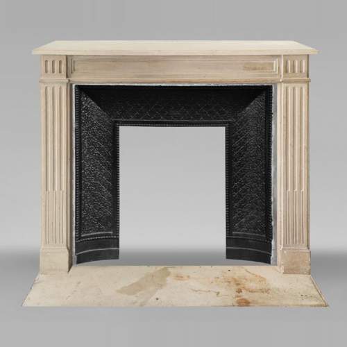 Louis XVI style stone fireplace, decorated with fluting