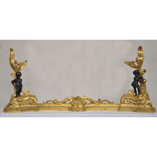 Antique bronze firedog with exotic figures.